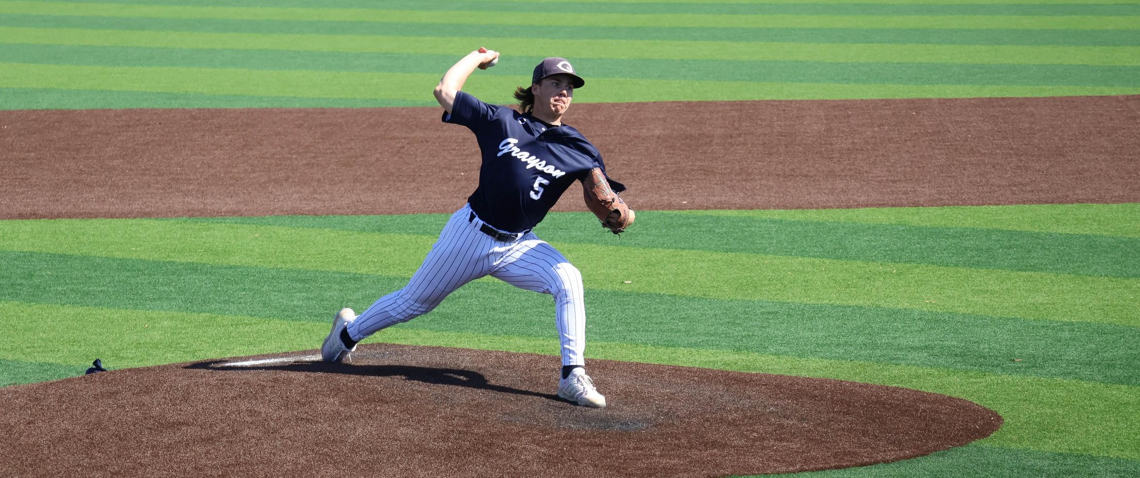 The Grayson Viking pitcher in navy uniform throws a pitch to Howard. 