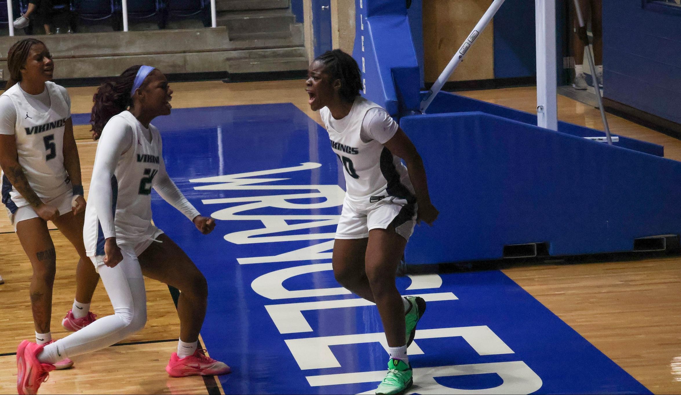 The Grayson Vikings celebrate a made basket against McLennan
