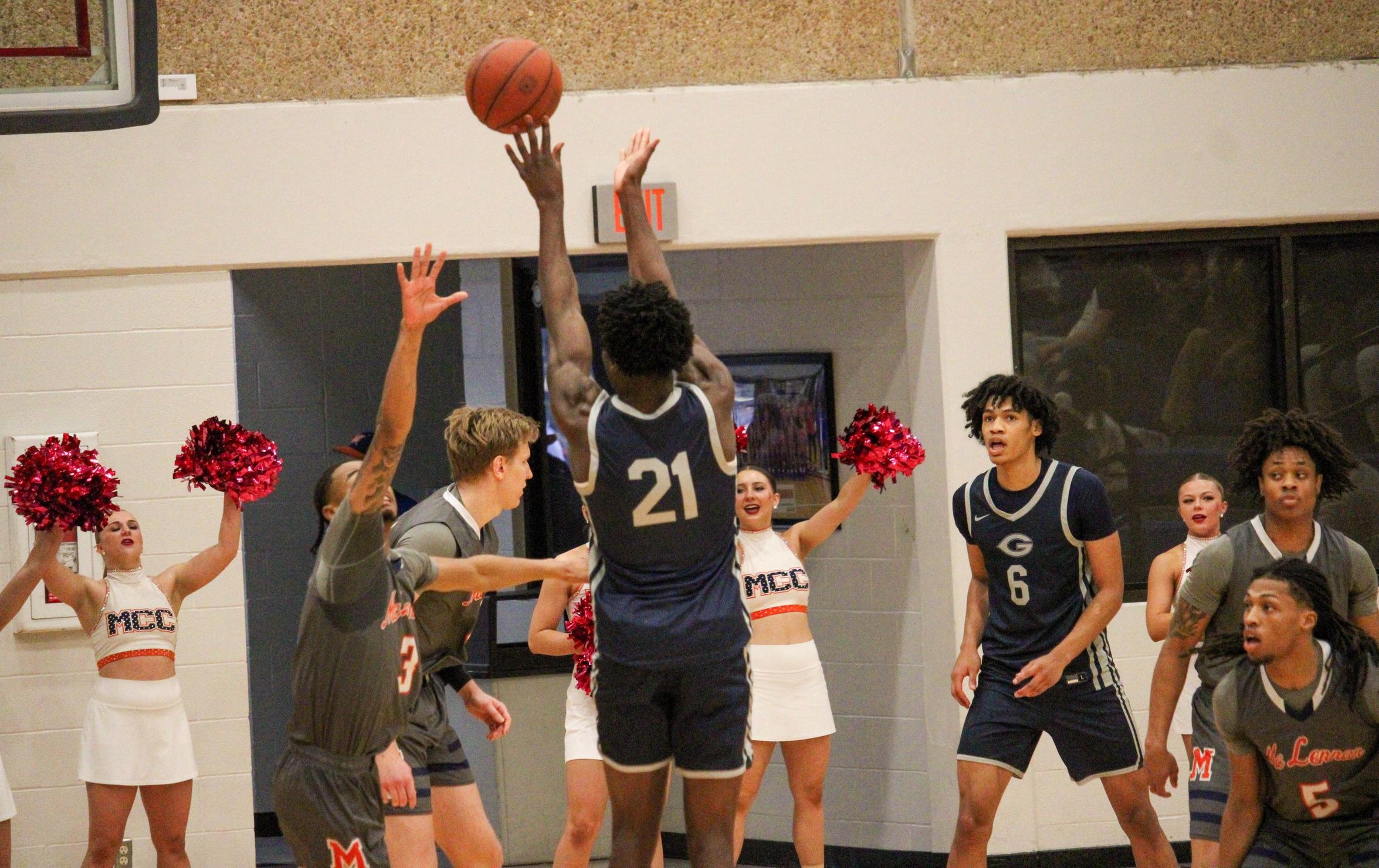 The Grayson Viking basketball player shoots a jump shot over the defender in the Grayson game against McLennan last weekend.